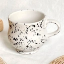 Thumbnail 1 of แก้วน้ำสีขาวเพ้นด้วยลายจุดสีดำ 390 ml. Ink dot mug